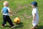 Babies playing soccer.